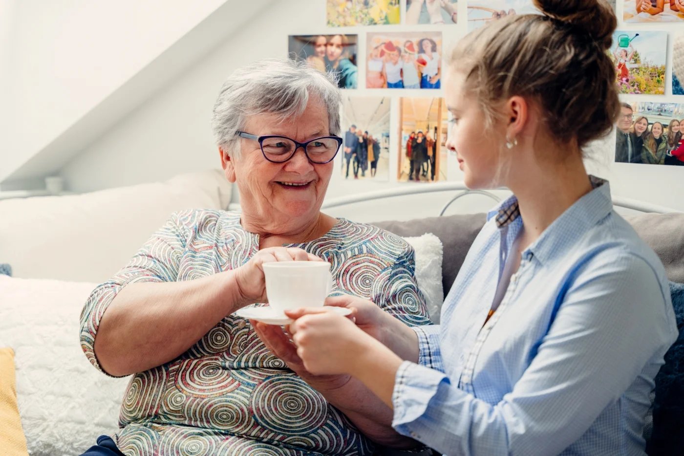Elderly woman drinking a cup of tea
