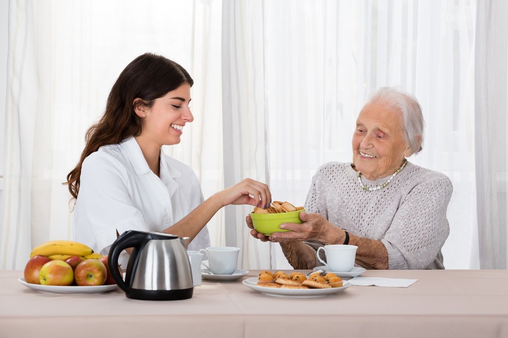 older-person-being-served-food