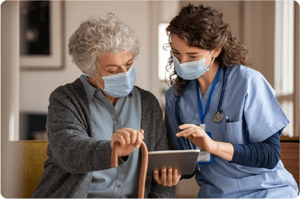 Resident and carer using device