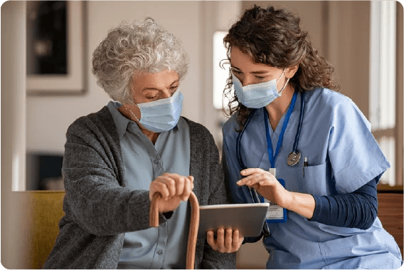 Resident and carer using device